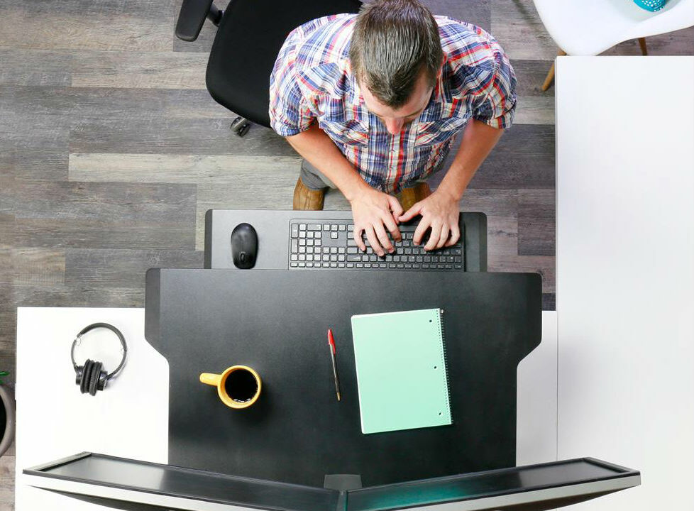 Back pain at work: How to sit at your desk properly